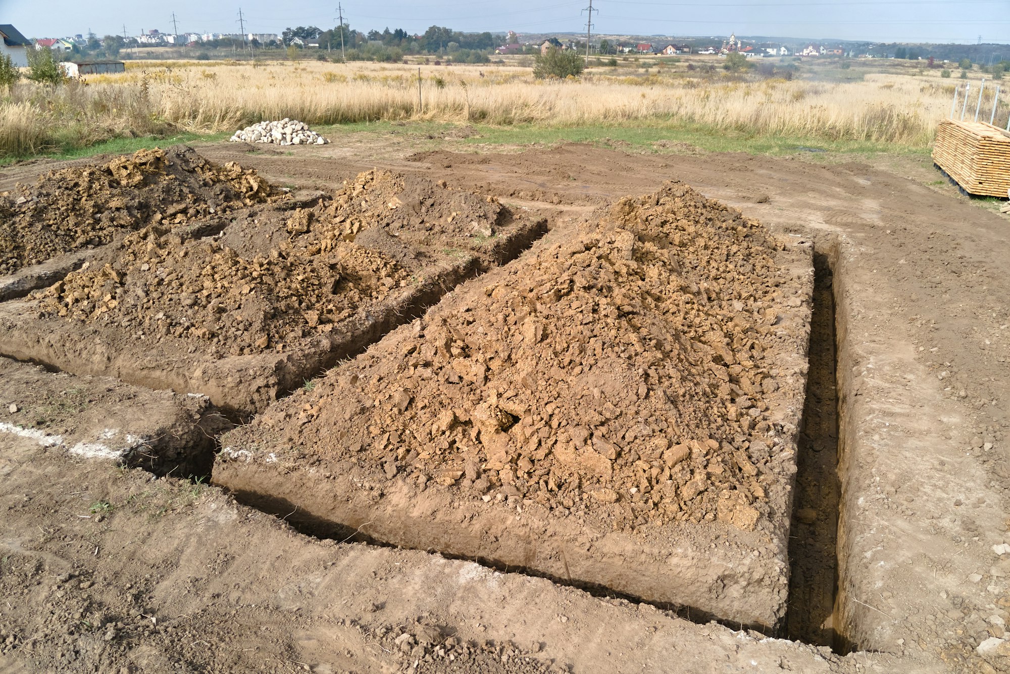 Dug out trench for building works of new house concrete foundation on construction site